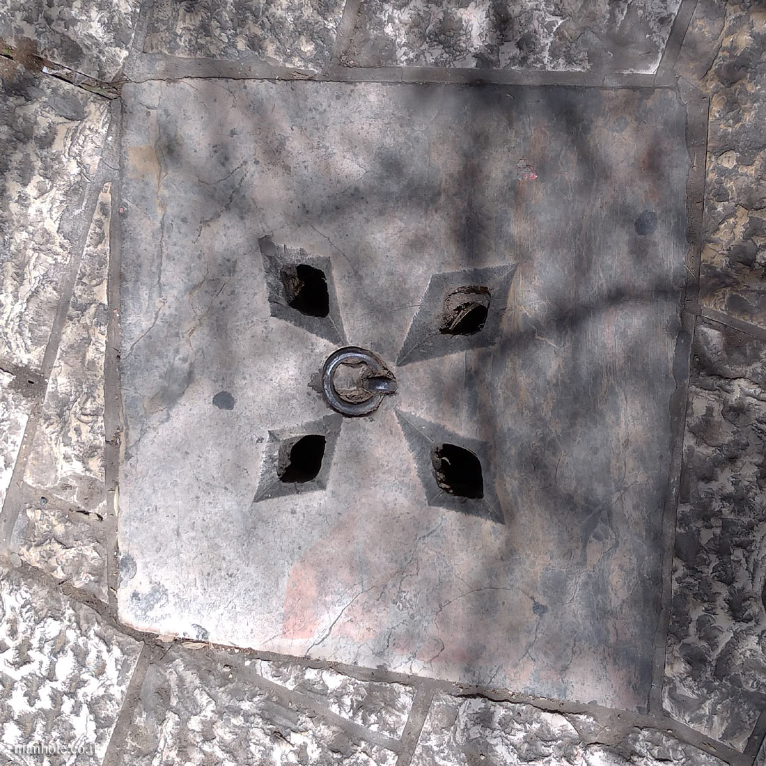Jerusalem - Old City - Drainage cover with holes in the shape of a diamond and a lifting handle