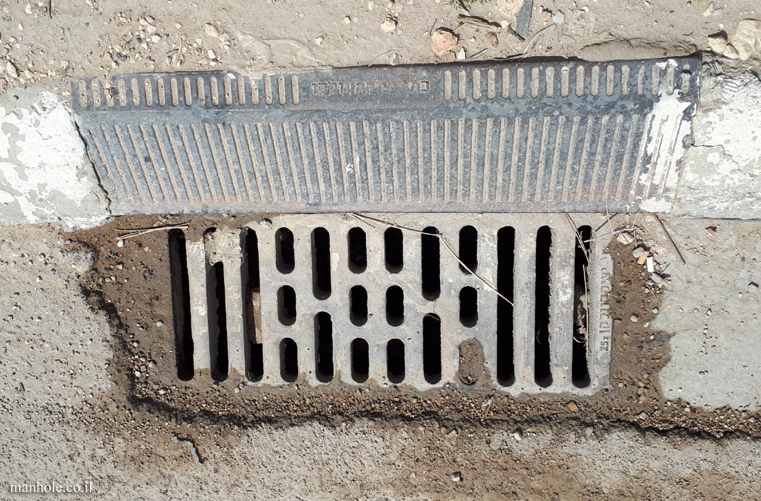 Kafr Qasem - A sidewalk drain with a sloping upper part
