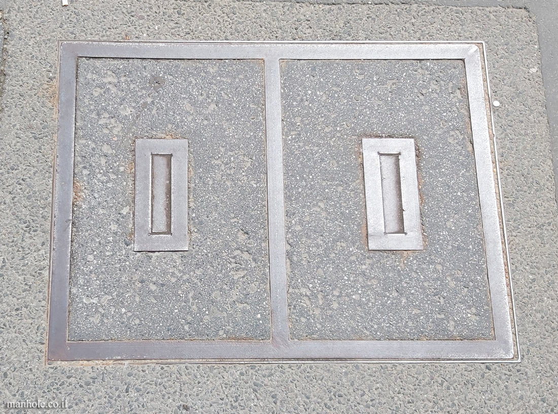 Budapest - Concrete lid with metallic rectangular opening handles