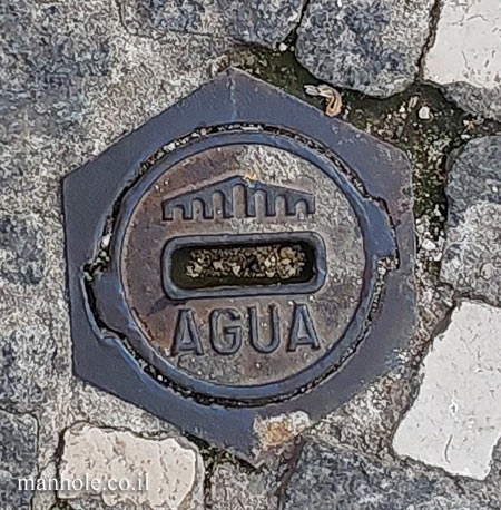 Lisbon - a tiny water lid surrounded by a hexagonal frame