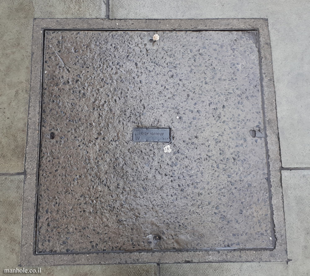 London - EDF - concrete cover with a metal label