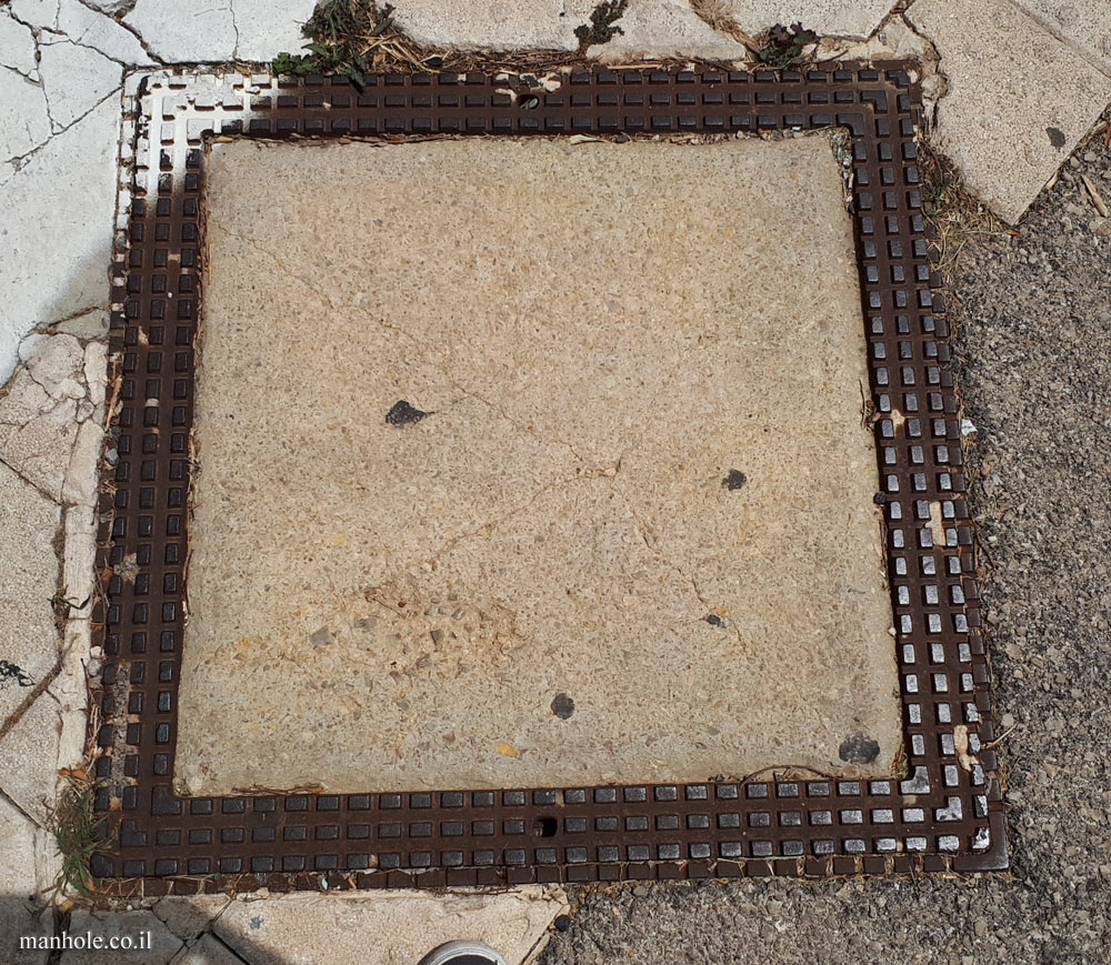Haifa - concrete cover with a metal frame with lines on it