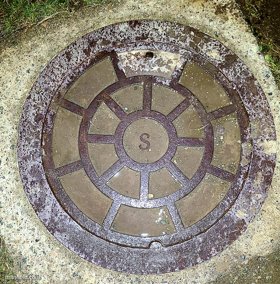 St. John’s, NL - Sewer - cover with the letter S in the center